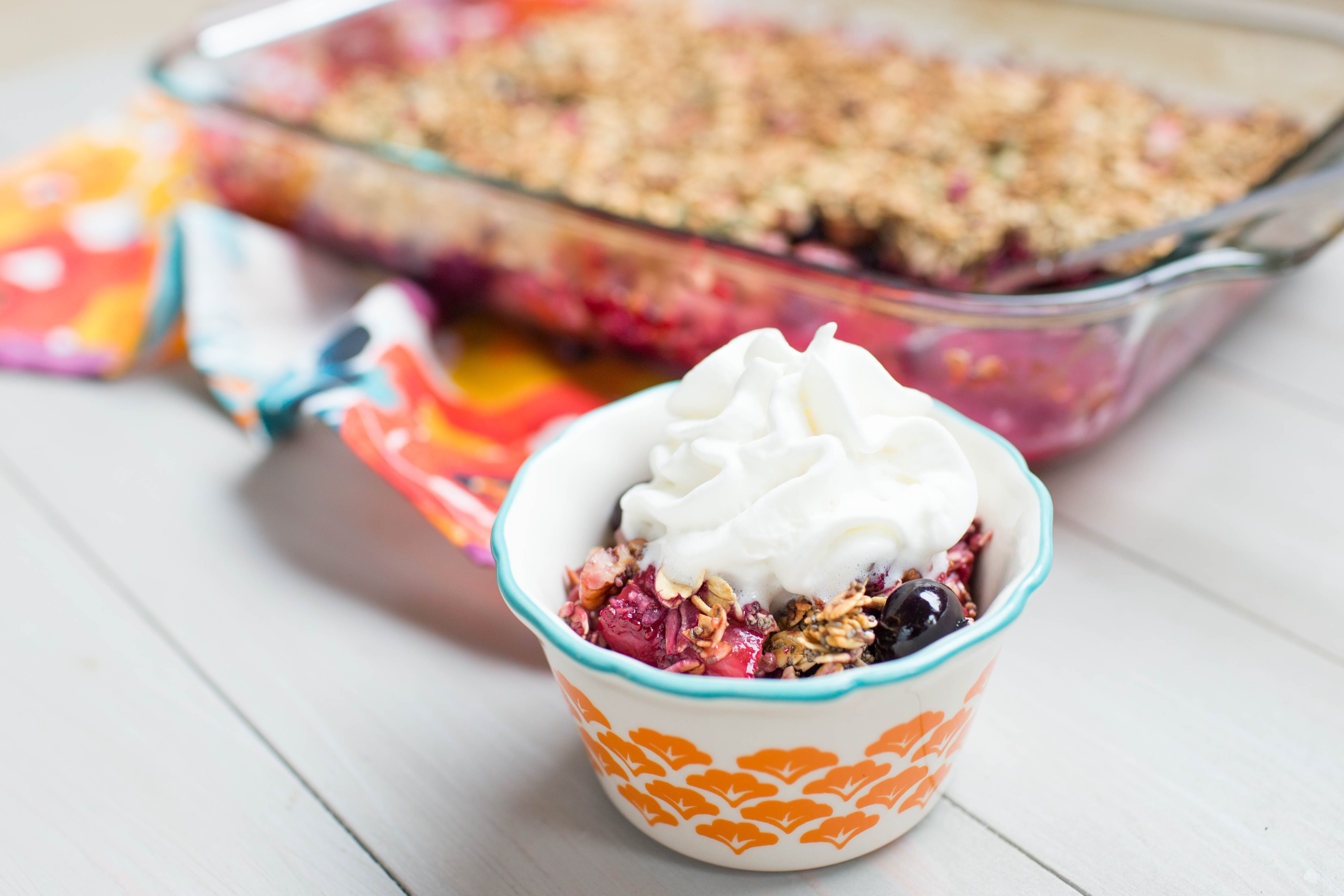 This summer berry crisp is the perfect dessert or breakfast treat! Gluten and dairy free! | read more at happilythehicks.com