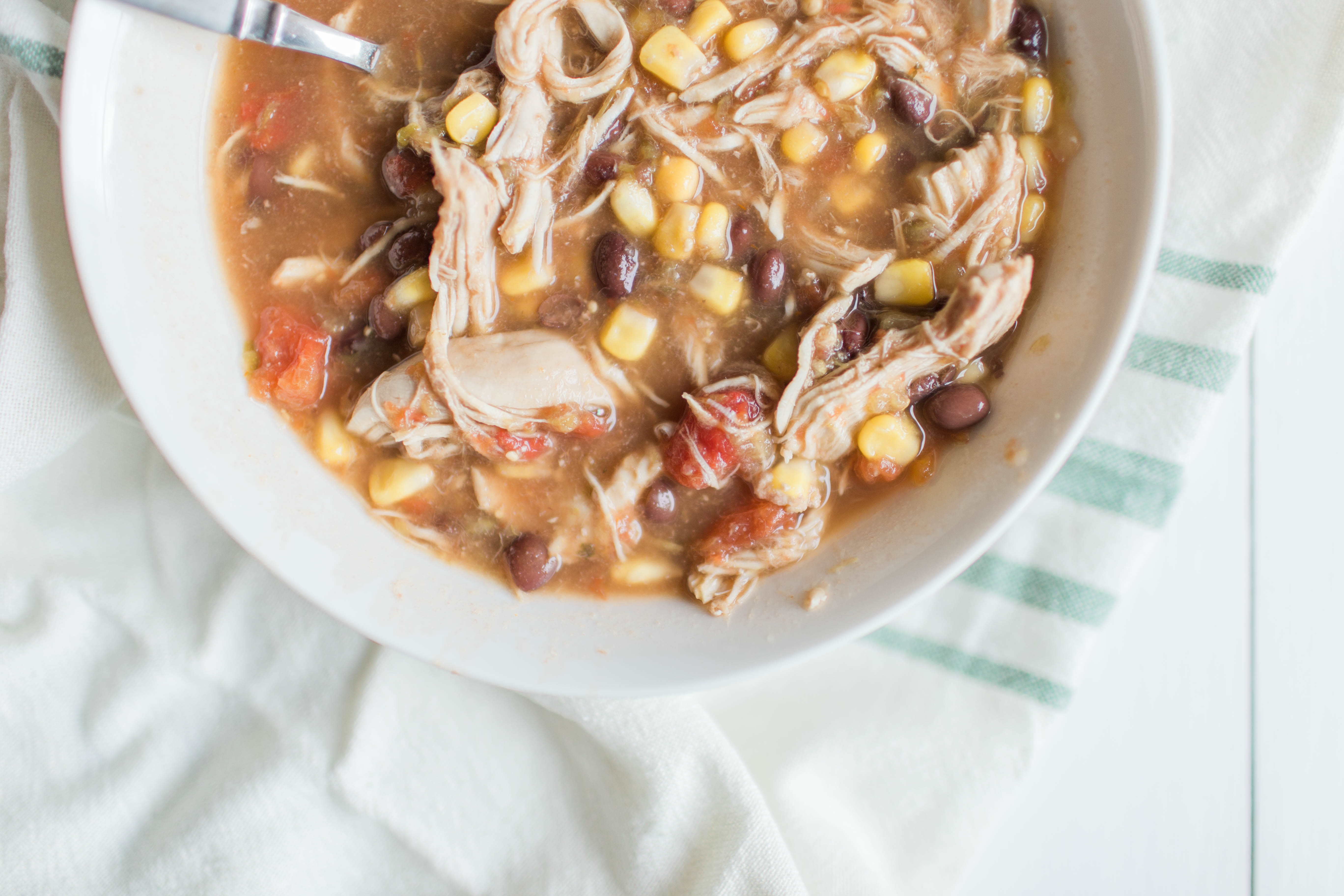 This shredded chicken taco soup is THE perfect meal to make for a cold winter's night! | read more at happilythehicks.com